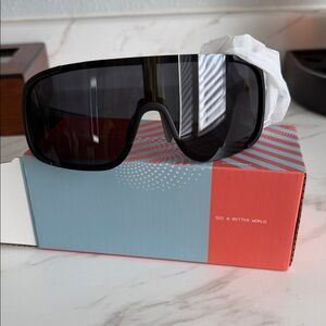 Polarized Sports Sunglasses Black/gray never worn. Still in box.